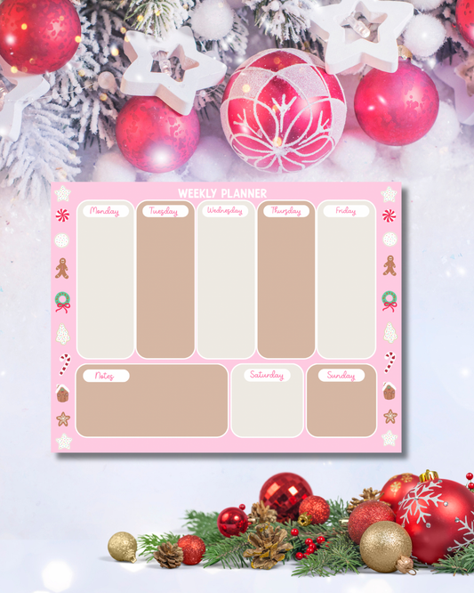 Pink Christmas weekly planner pad with reindeer, gingerbread, and snowman illustrations — Tomes & Troves